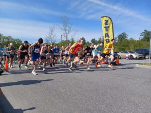 People running from start line on sunny day