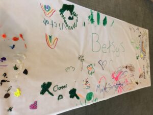 hand painted banner that reads Betsy's